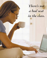 Woman on computer - 'There's not a bad seat in the class'